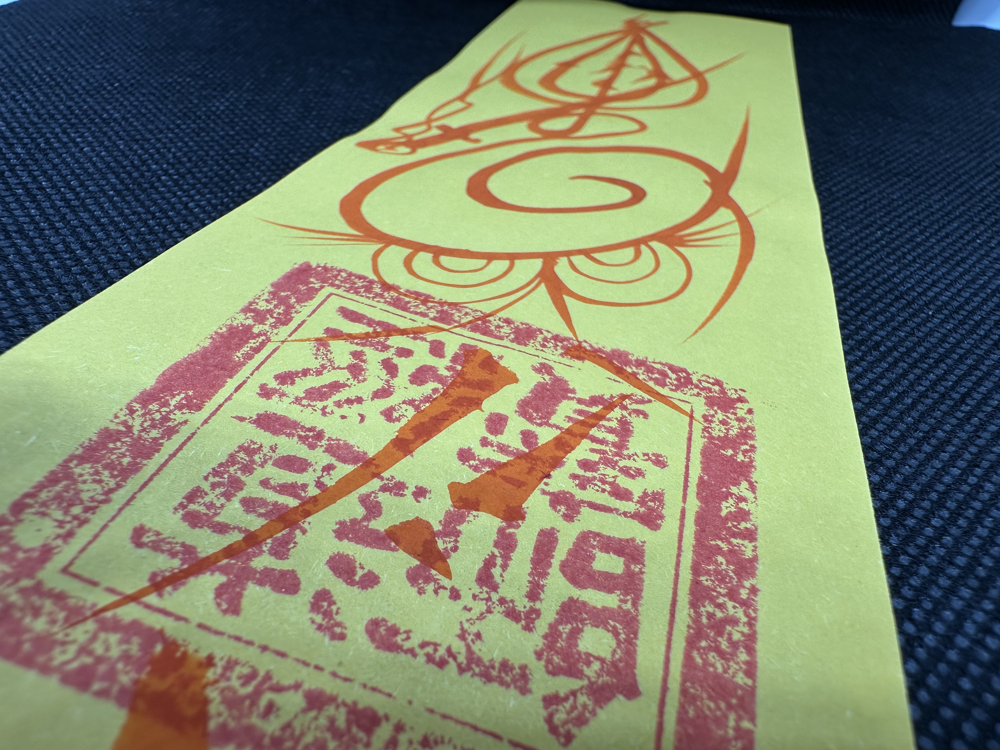 Cinnabar detail on hand-drawn talisman art